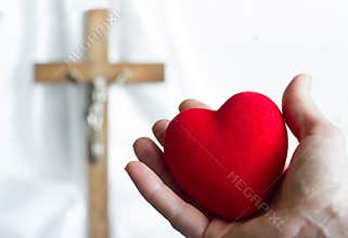Giving heart to Jesus abstract concept with easter cross