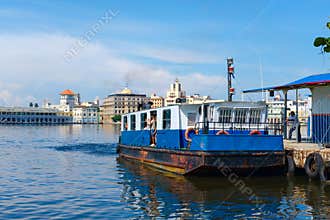 Small ferry boat carries passengers across the bay of Havana in Cuba