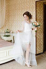 Brown-haired woman with classic wedding hair-style.