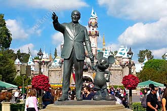 Bronze Walt Disney holding Mickey Mouse's hand statue at Disneyland