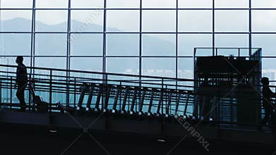 Silhouettes of Commuter in Airport.