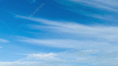 Clouds moving in the blue sky