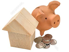 House of building blocks, coins and moneybox