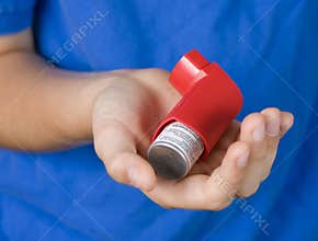 Asthma Inhaler in Hand