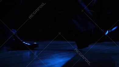 Gangster with a gun goes in the building.