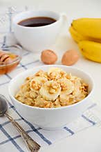 Oatmeal porridge with banana, honey and walnuts