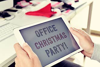 Text office christmas party on a tablet