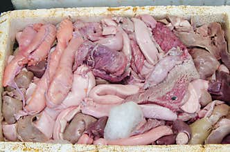 Fish body parts on a plate at fish market
