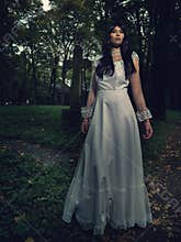 Witch from the cemetery, in front of cross