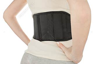 Woman wearing back support belt isolated on white