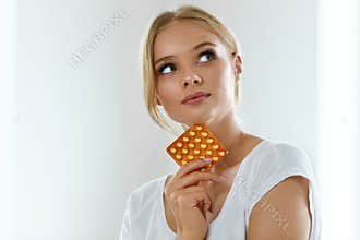 Beautiful Woman Holding Birth Control Pills, Oral Contraceptive