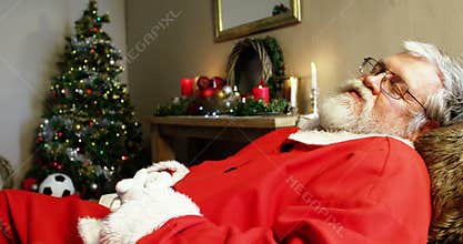 Santa claus resting on the couch