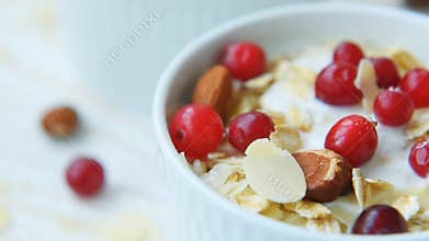 Yogurt with cranberries, almonds, oatmeal, almond flakes