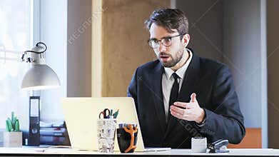 Young Businessman Surprised After Reading a Message