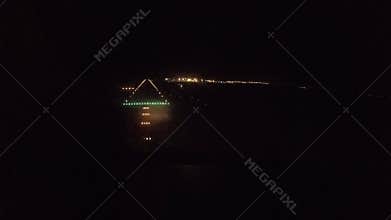 Airliner the approach and landing at the airport at night. the view from the cockpit.