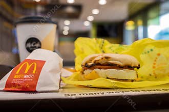 SAN ANTONIO, TX, USA - NOVEMBER 9, 2018 - Breakfast at McDonald`s restaurant with egg Mcmuffin sandwich, hash brown potatoes and