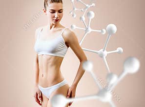 Woman with perfect body near big molecule chain. Slimming concept.