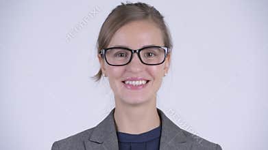Face of happy young beautiful businesswoman with eyeglasses smiling