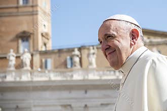 Pope Francis smiling to faithful as he arrives for his weekly general audience