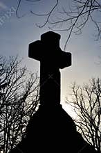 Cross Silhouette with Tree Branches