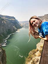 Young tourist girl on vacation at Twin Falls in Idaho