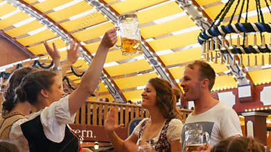 September 17, 2017 - Munich, Germany:World famous Oktoberfest beer festival, beautiful young people having fun, dancing