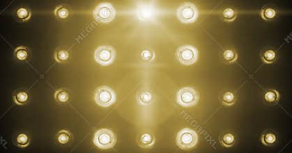 Flashing shiny golden stage lights entertainment, spotlight projectors in the dark, gold warm soft light spotlight strike on black