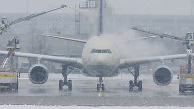 Airplane at deice pad, defrosting, Munich Airport