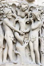 Notre dame cathedral main entrance, detailed view of Adam and Eve scene