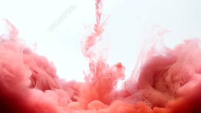 Red and blue ink dropped into water.