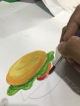 Painting a burger using watercolor paint brush