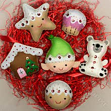 Handmade star bear elf cookies house cake on red tinsel