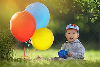 First birthday celebration of the little boy on a warm summer day in the orange light