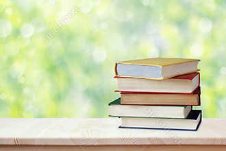 Pile of books in color covers. Workplace of the student. Back to school. Education, study, science