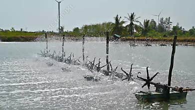 Water turbines are used to increase oxygen in aquaculture ponds video Slow motion 120 frame