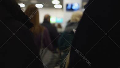 Queue of people at airport to buy ticket or pass border control, flight delay