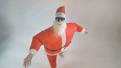 Santa in sunglasses makes beckoning gestures. Invitation Concept.