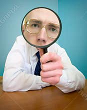 Funny people with a magnifier