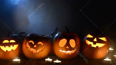 Halloween pumpkins on smoky background