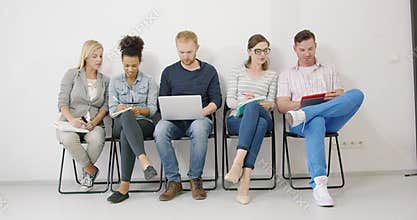 Colleagues making notes and sharing ideas