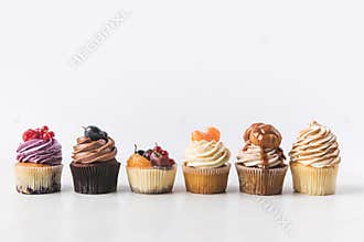 Close up view of various sweet cupcakes on cake stand