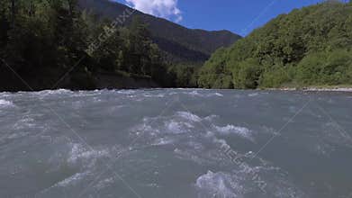 Panorama in front of the water. Mountain river close-up. The Landscape Of Russia. Arkhyz