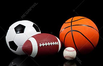 Sports balls on a black background