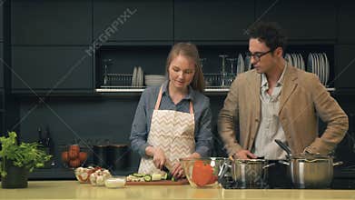 Young and happy couple in the kitchen