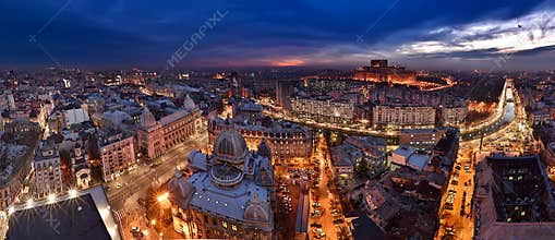 Bucharest skyline at blue hour, Dambovita river, aerial view