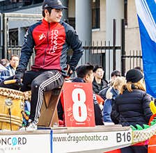 VANCOUVER, CANADA - February 18, 2018: Man in dragon boat at Chinese New Year parade in Vancouver Chinatown.
