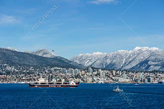 VANCOUVER, CANADA - February 18, 2018: Busy harbour with north Vancouver on background sunny day.