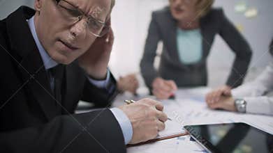 Unhappy manager avoiding eye contact with annoyed woman boss, job stress