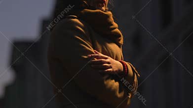 Woman wait for boyfriend, stay alone in evening, look around, abandoned on date