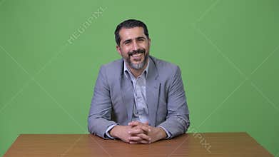 Handsome Persian bearded businessman talking